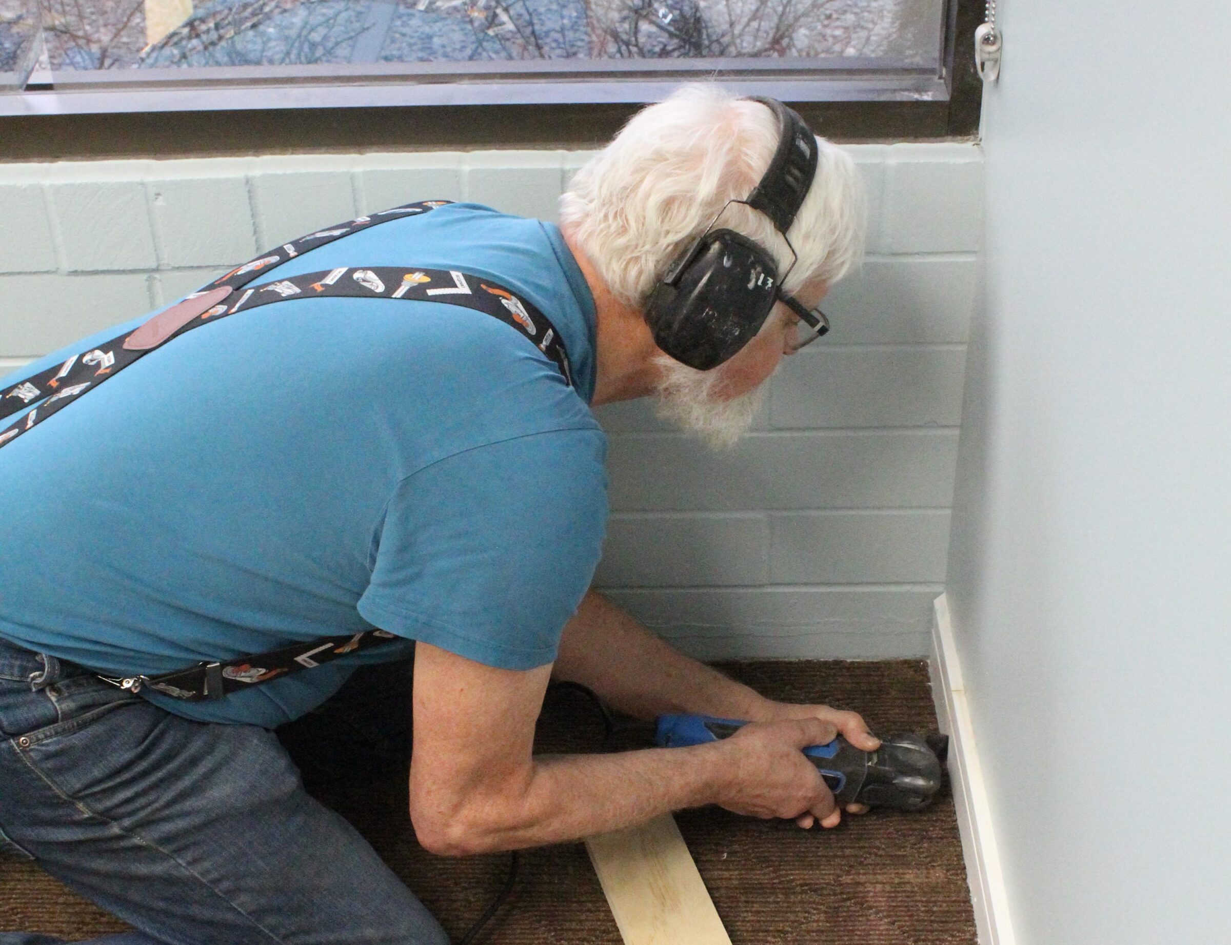 Arny Putting On Base Boards During Office Reno