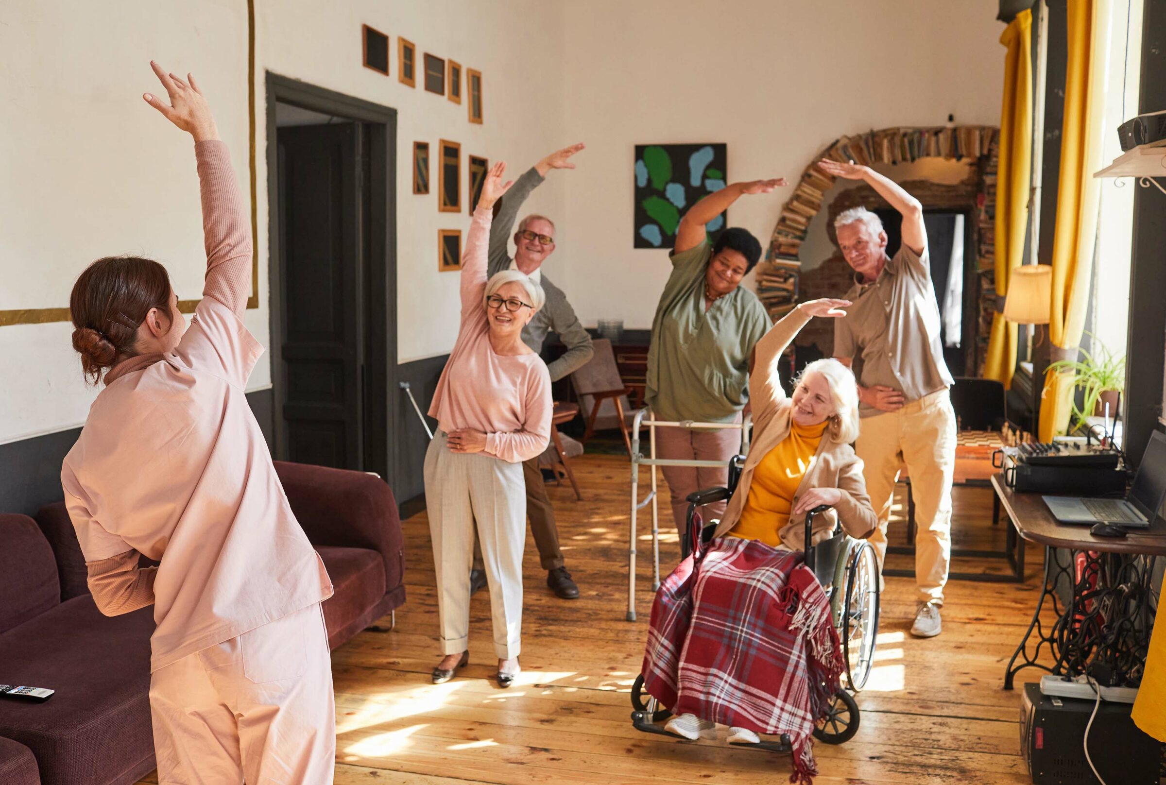 Senior People Stretching In Retirement Home